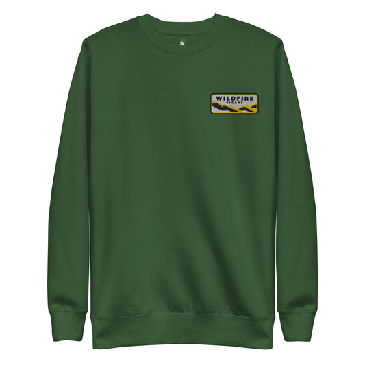 Wildfire Cigars embroidered left chest on forest green premium sweatshirt facing the front